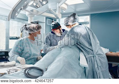 A Team Of Women And Men Surgeons Doing Complex Heart Surgery, Cardiovascular Surgery, Modern Medicin