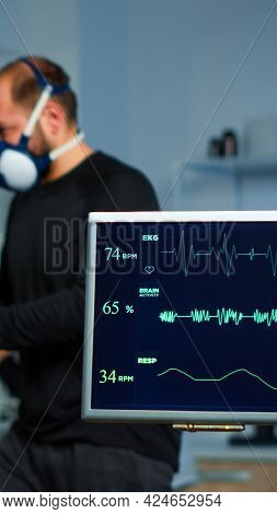 Team Of Medial Researchers Monitoring Vo2 Of Man Performance Sports Wearing Mask Running. Lab Scienc