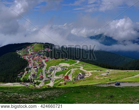 Beautiful scenic view in a rainy and cloudy day over the Transalpina road, the highest mountain road in the Carpathians located in the Parang mountains, Romania, Europe
