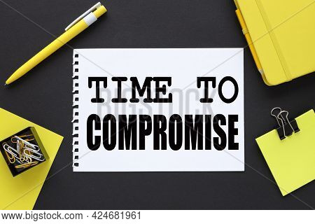 Time To Compromise. Text On A Black Background, On White Paper, Next To Bright Stickers And A Yellow