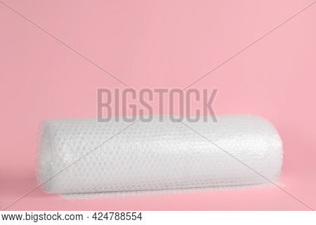 Bubble Wrap Roll On Pink Background, Space For Text