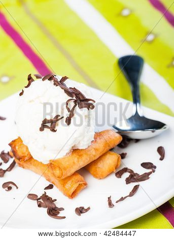 fried custard wrapped lumpia wrapper topped with vanilla ice cream and shaved truffle chocolates