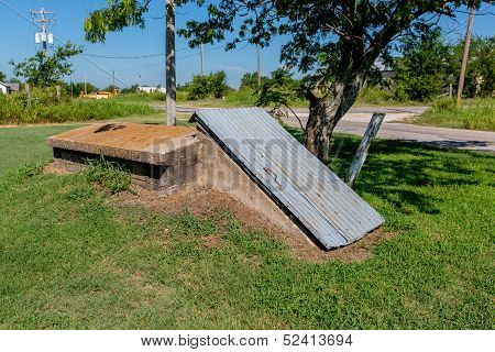 An Old Storm Cellar or Tornado Shelter in Rural Oklahoma.