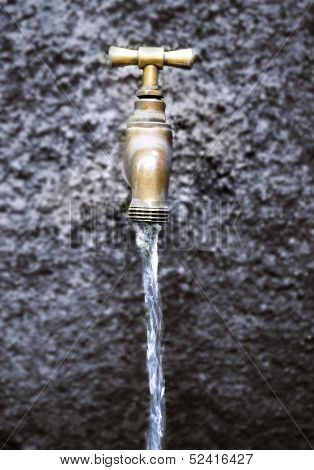 Water running from outdoor tap