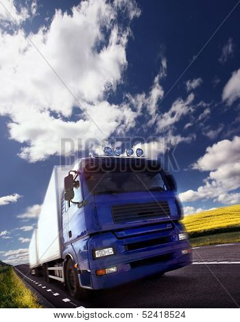 Photo of a truck driving at day/motion blur