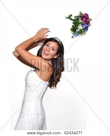 Happy bride throwing up a flowers bouquet.