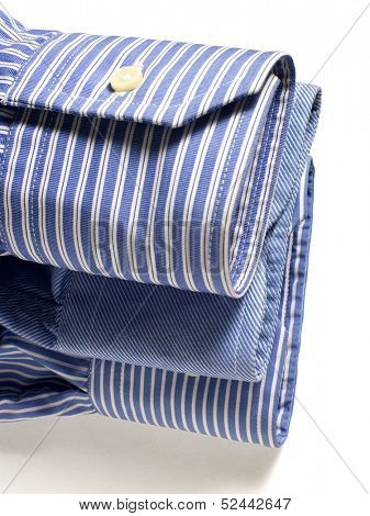 Three blue shirts' finger laying on each other