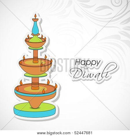 Indian festival of lights, Shubh Dipawali (Happy Dipawali) greeting card with colorful traditional oil lit lamps on floral decorated grey background. 