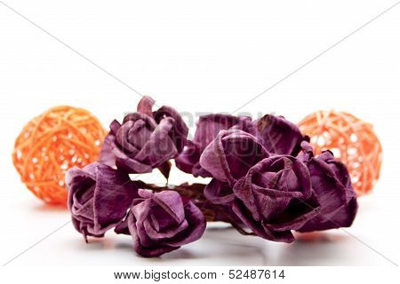 Wooden balls with dry roses