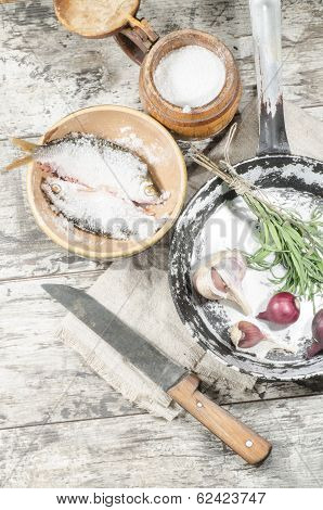 Two Roaches Fish In Ceramic Bowl With Salt.