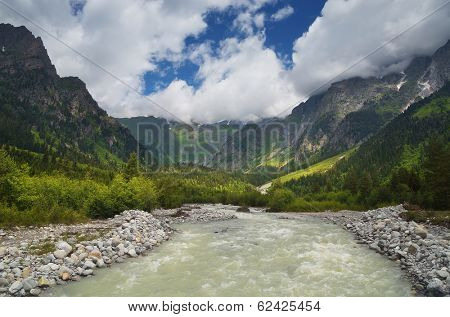 Cold mountain river with raging stream. Alpine landscape sunny day. Zemo Svaneti, Georgia, Caucasus