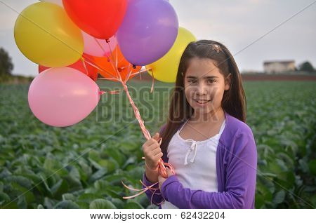 A Teenage Girl In Purple With Colorful Balloons