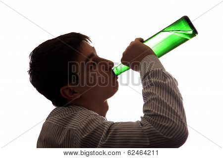 Young Man Drinks A Beer