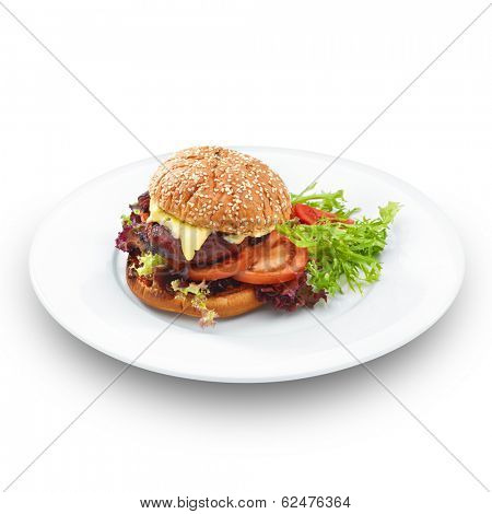 Fresh tasty hamburger with geilled patty and cheese served with vegetables. Isoltaed on white.