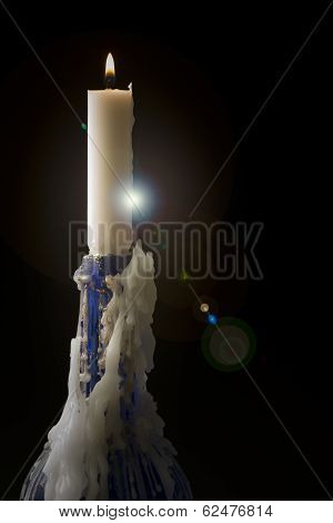 Candle Flame And Blue Bottle