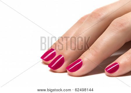 Woman hands with manicured pink nails closeup. Skin and nail care.