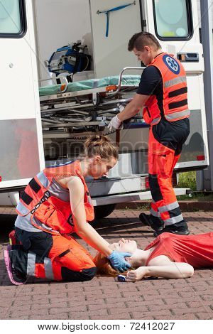 Paramedic Giving First Aid