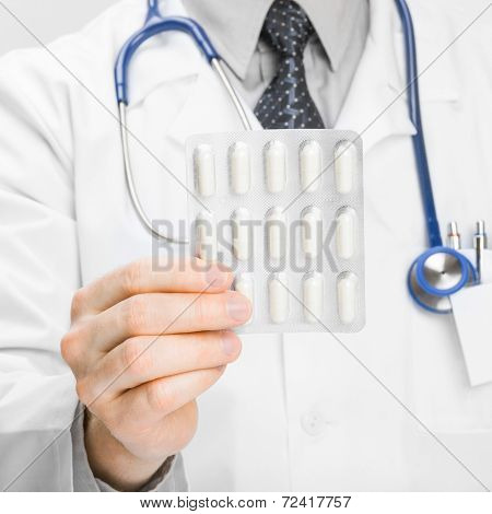 Doctor Holdling Pills In His Hand - Heath Care Concept