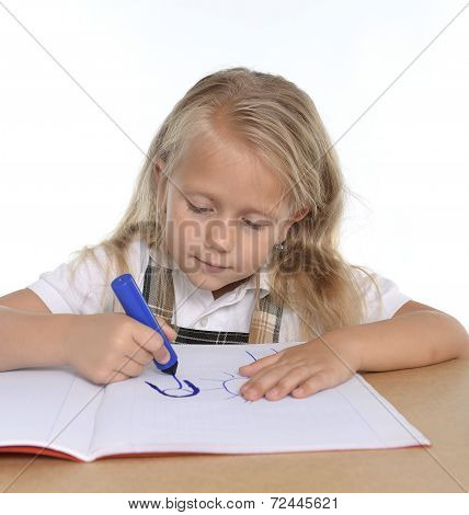 Cute Little Schoogirl Happy On Desk Drawing On Notepad With Marker