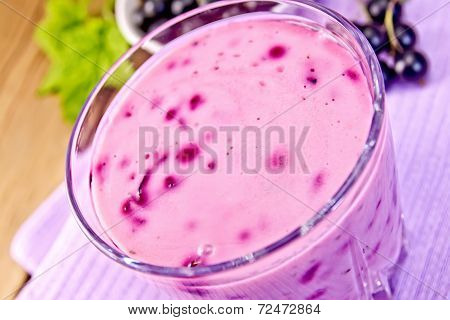 Milkshake With Black Currants In Glass On Board