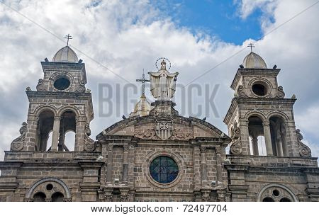 Statue at the top of a church's facade