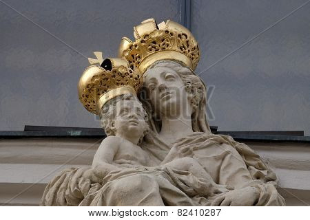 GRAZ, AUSTRIA - JANUARY 10, 2015: Virgin Mary with baby Jesus on the portal of Mariahilf church in Graz, Styria, Austria on January 10, 2015.