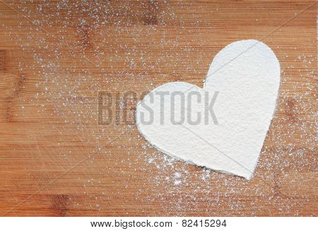 shape of heart on wooden background
