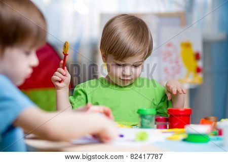 kids with play clay at home