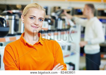 Positive seller or shop assistant portrait  in supermarket store