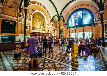 HO CHI MINH, VIETNAM - APRIL 28, 2014: Customers and tourists at the General Post Office. It was built by the French in 1880s and is now a popular tourist attraction in Ho Chi Minh city