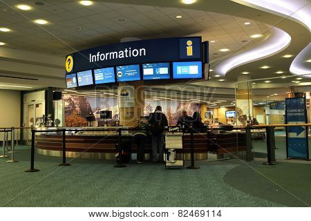 Vancouver, BC Canada - September 13, 2014 : People asking some information insdie the YVR airport in Vancouver BC Canada. 