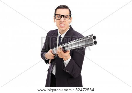 Angry businessman holding a shotgun isolated on white background