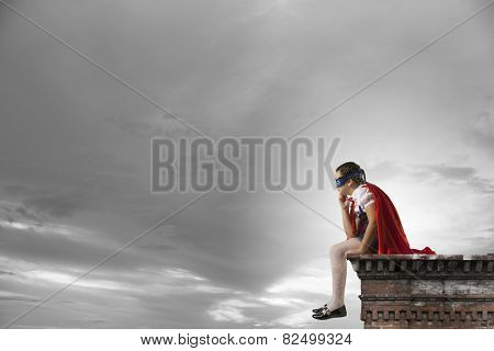 Girl of school age in super hero costume