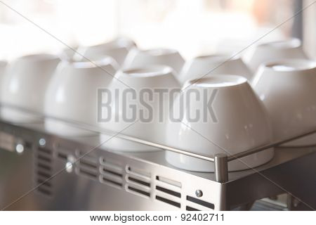 Empty coffee cup on coffee machine