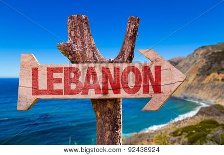 Lebanon wooden sign with coast background