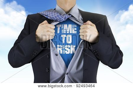 Businessman Showing Time To Risk Words Underneath His Shirt