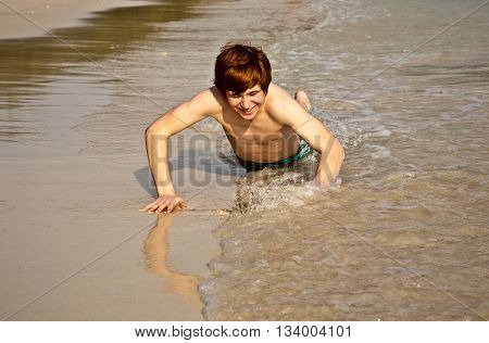 Cute Boy Enjoying The Beac