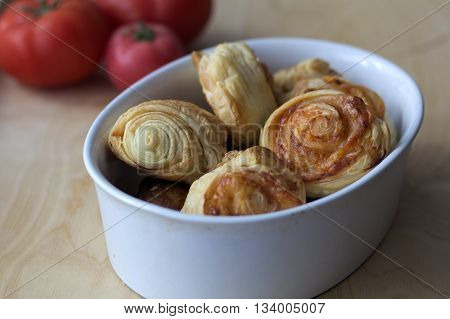Dry spiral puff pastry as small pizzas
