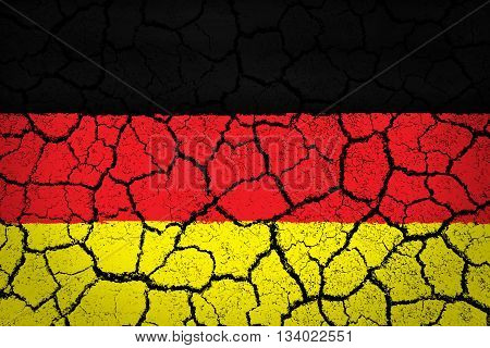 The German flag painted on cracked ground with vignette