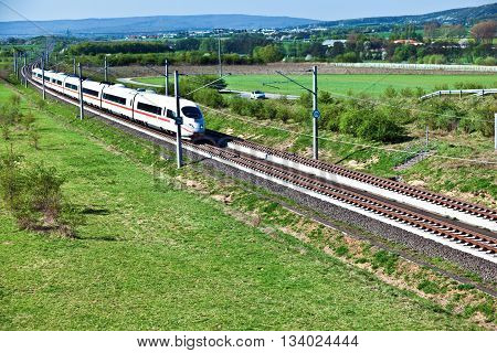 RAUNHEIM, GERMANY - June 3, 2011: high speed train with full speed in landscape