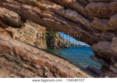 Hole in rock - resort Rafailovici - Montenegro - nature background