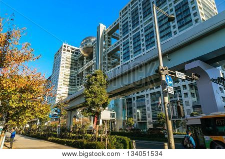TOKYO JAPAN - NOVEMBER 27 2015: Fuji T.V. headquarters one of the most striking buildings in Japan. its' futuristic metallic clad building featuring a massive silver ball 32 metres in diameter