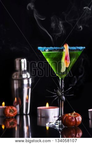 Green halloween cocktail witch's brew. Selective focus