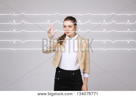 Doctor woman working with cardiogram lines