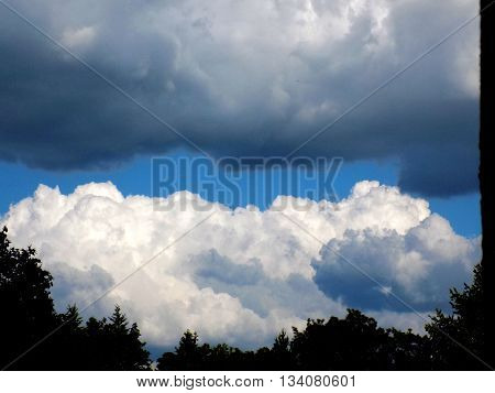 Cumulonimbus convective cloud indicating storm formation through low pressure system in unstable atmosphere during summer