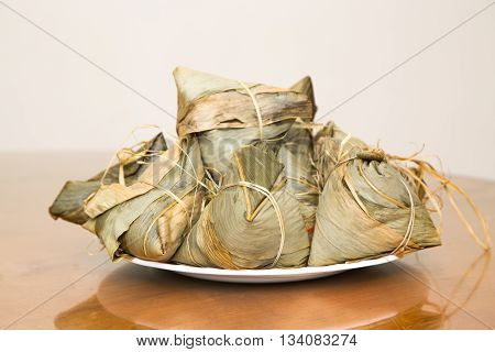 Traditional Duanwu Chinese Rice Dumplings Stacked On Plate
