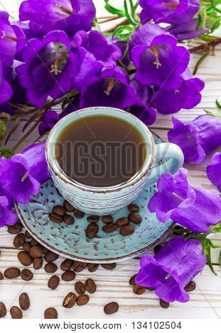Cup Of Coffee, Coffee Beans And Lilac Flowers