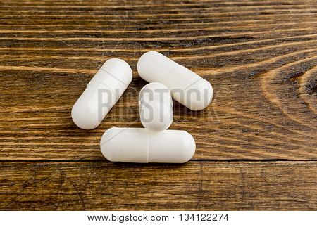 Meldonium doping for athletes. Abuse of anabolic steroids for sports.Heap of meldonium capsules