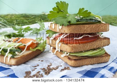 sandwiches with vegetables, fresh tomatoes, cucumbers and zucchini.