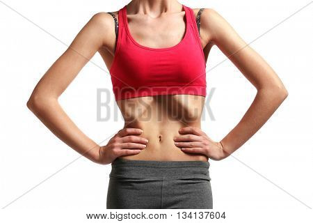 Belly of young woman with anorexia on white background